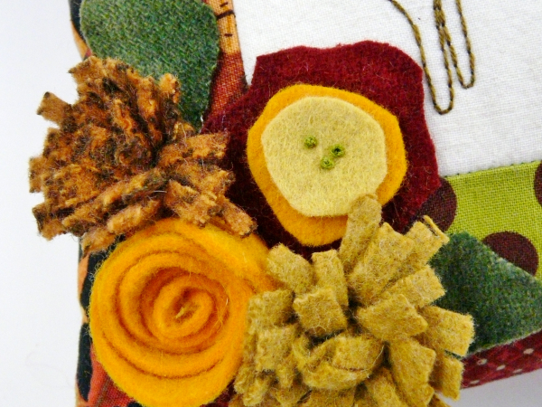 wool felt flowers on cat pillow