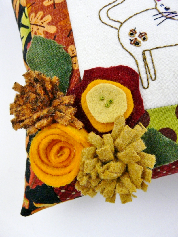 wool felt flowers on cat pillow