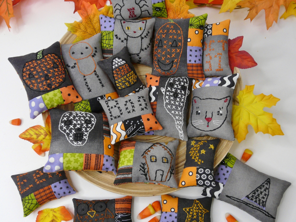 Halloween embroidery patchwork ornaments on dark fabric pattern