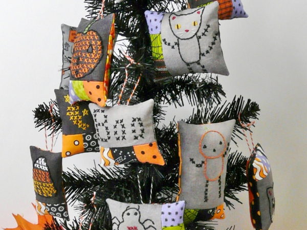 Halloween embroidery patchwork ornaments on dark fabric pattern
