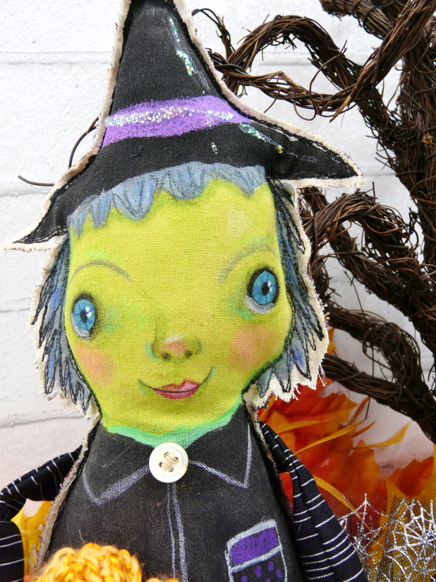 Green wicked witch doll - crocheted flower