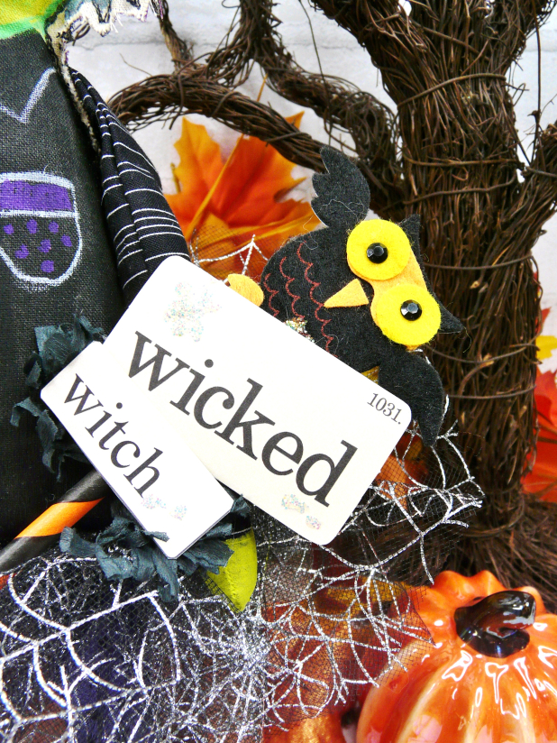 Green wicked witch doll - crocheted flower