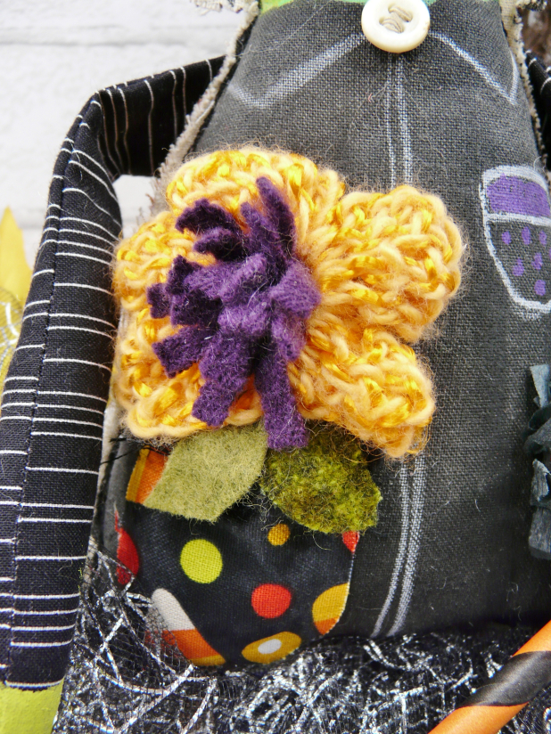 Green wicked witch doll - crocheted flower