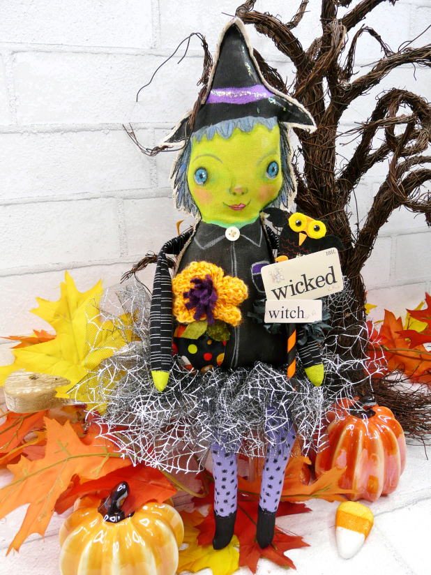 Green wicked witch doll - crocheted flower
