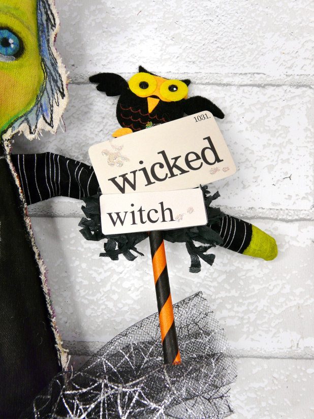 Green wicked witch doll - crocheted flower