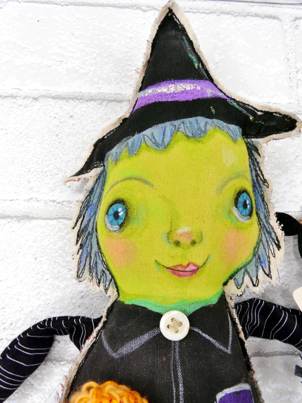 Green wicked witch doll - crocheted flower