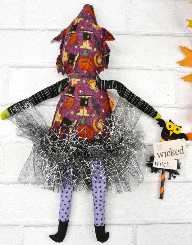 Green wicked witch doll - crocheted flower